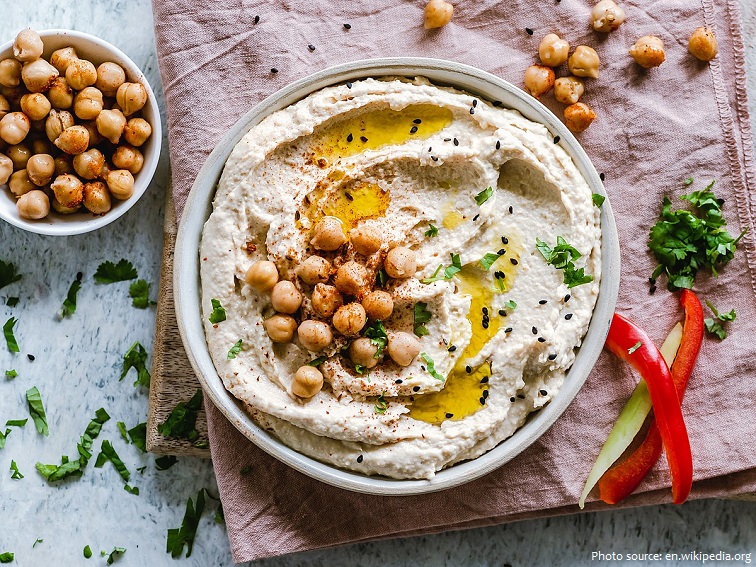 Hummus là một món ăn nhúng, phết hoặc mặn của Trung Đông được làm từ đậu gà nghiền, nấu chín, trộn với tahini, nước cốt chanh và tỏi.